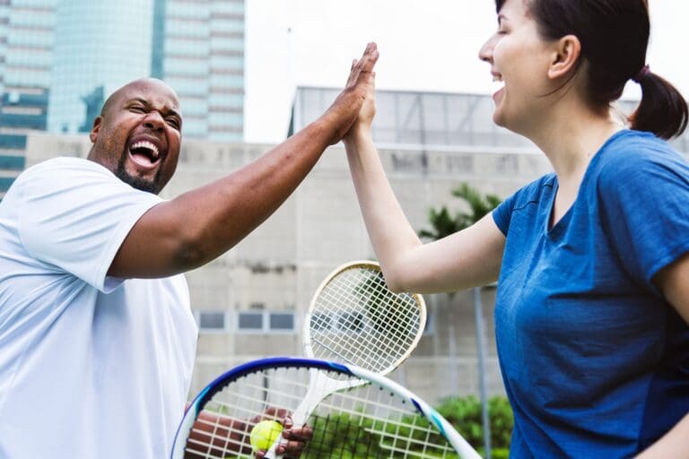 Hit your small business marketing goals like this couple hit that tennis score!